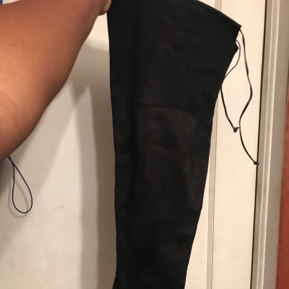 Black knee high boot. Never worn